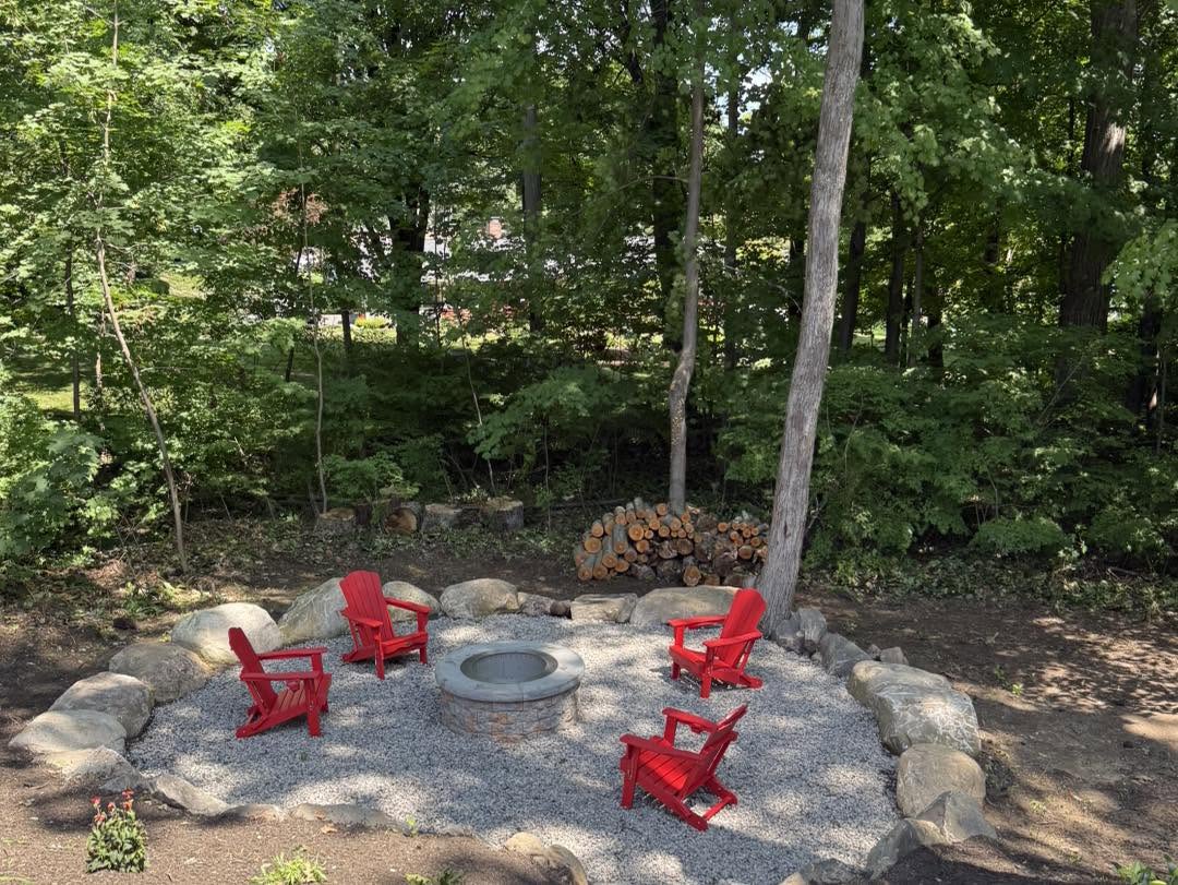 Finished fire pit patio and cleaned-up yard after property cleanup in Tolland County CT
